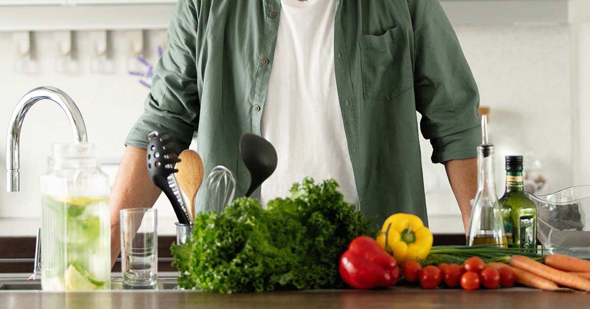 Kitchen table of fruits and vegetables.