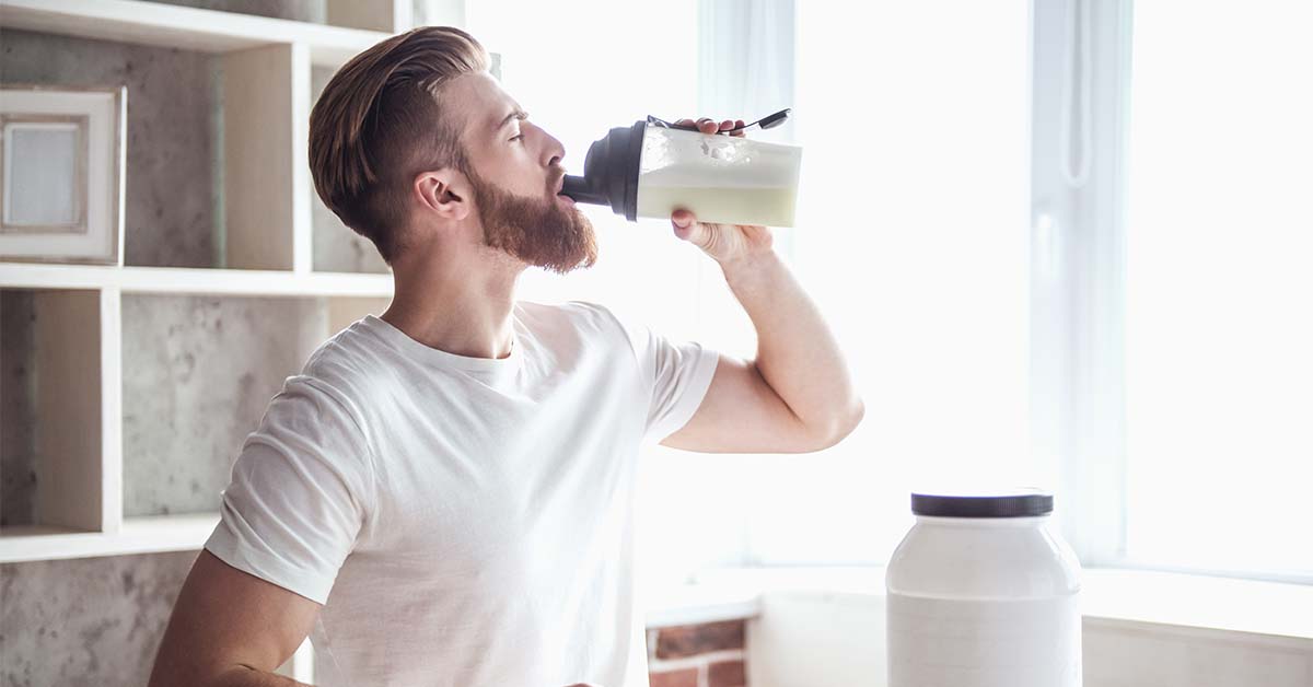 Man drinking protein shake.