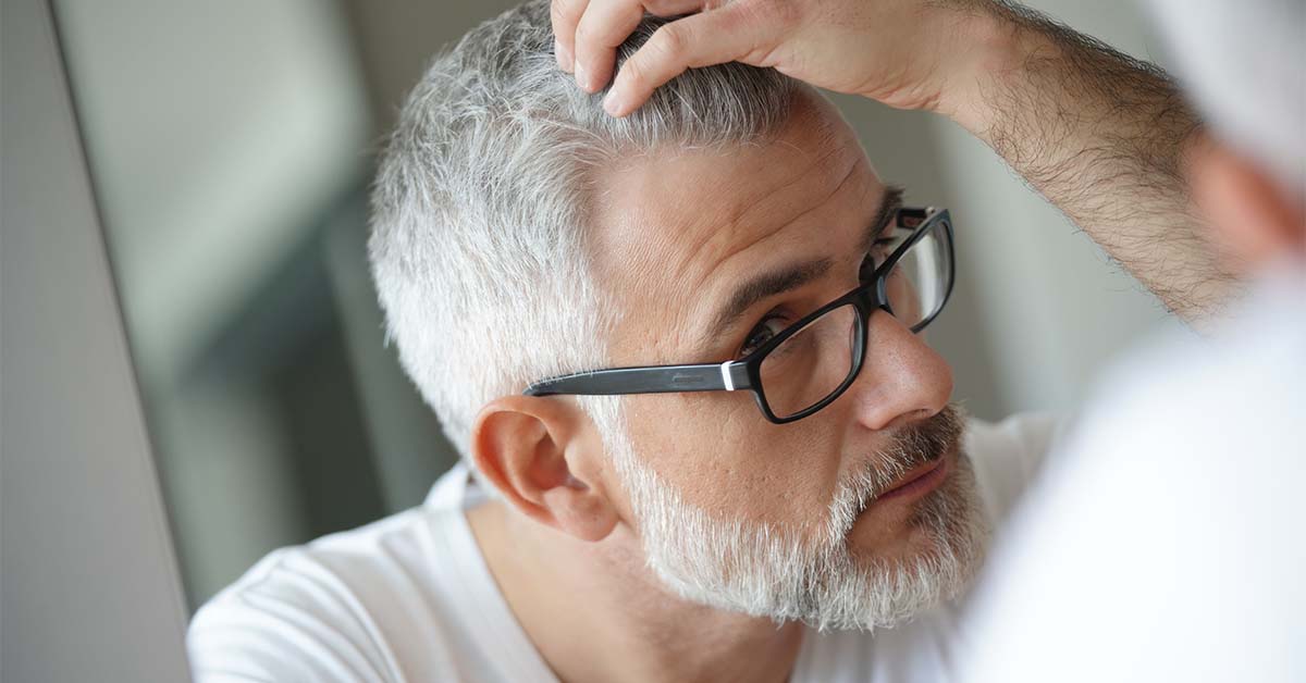 Aging, graying, and balding.