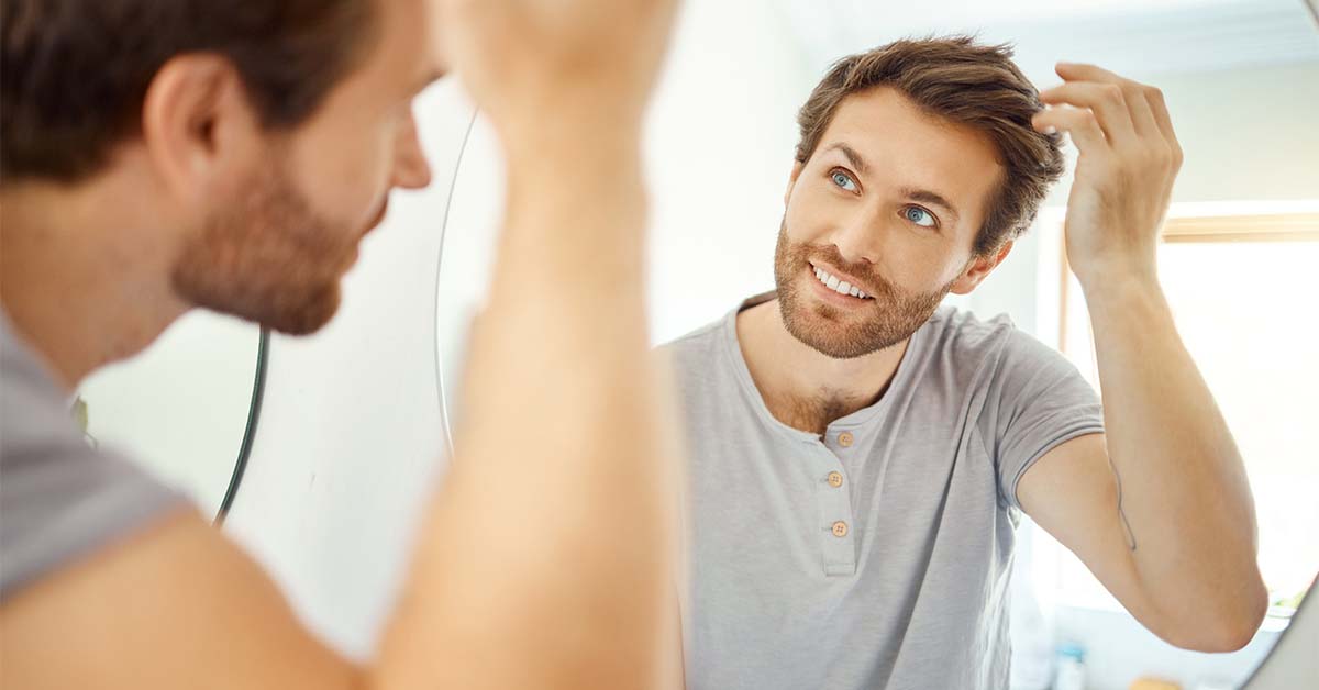Smiling man with head of hair