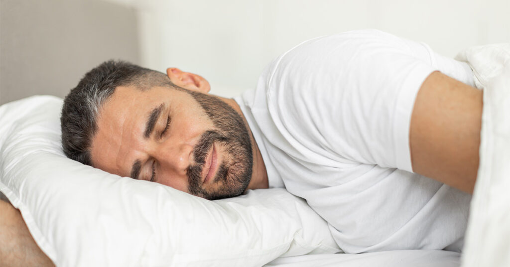 Man resting in bed